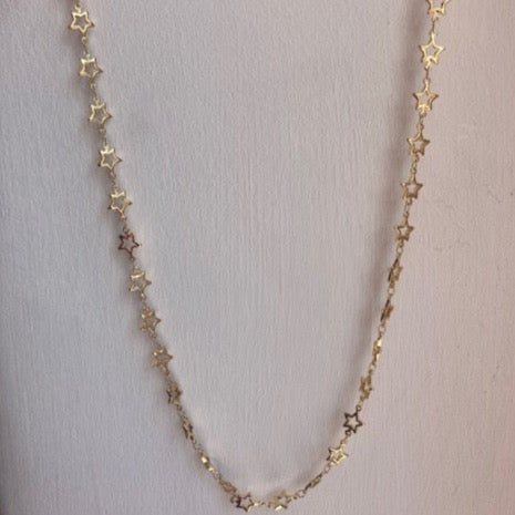 Collar largo de estrella abierta dorada