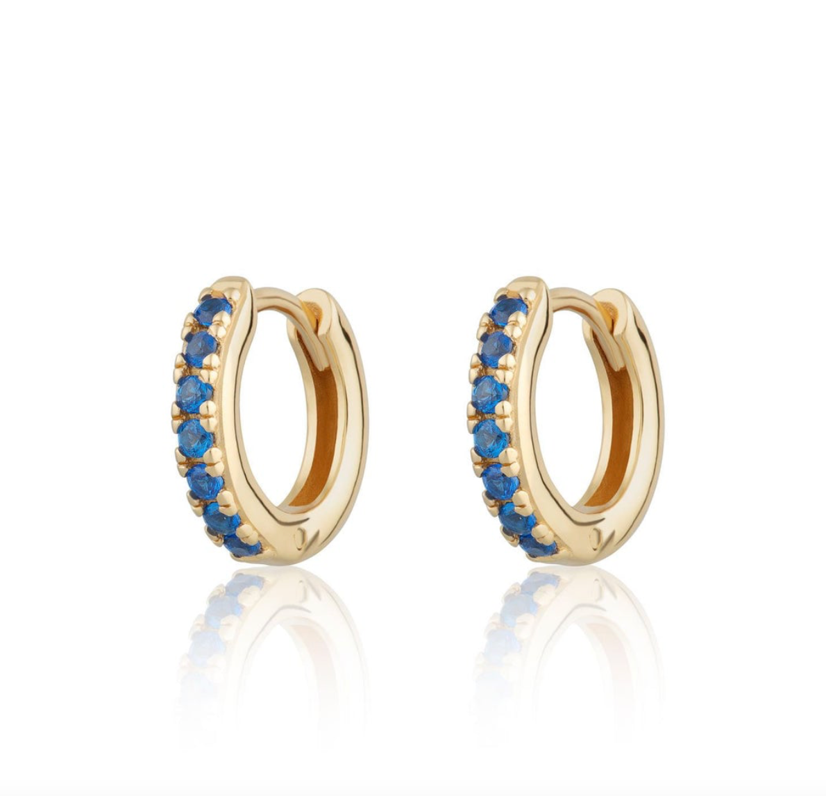 Gold huggies with blue stones