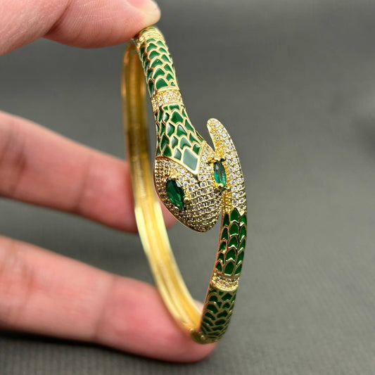 Close up of green snake bangle showing detailed scales and rhinestone embellishments