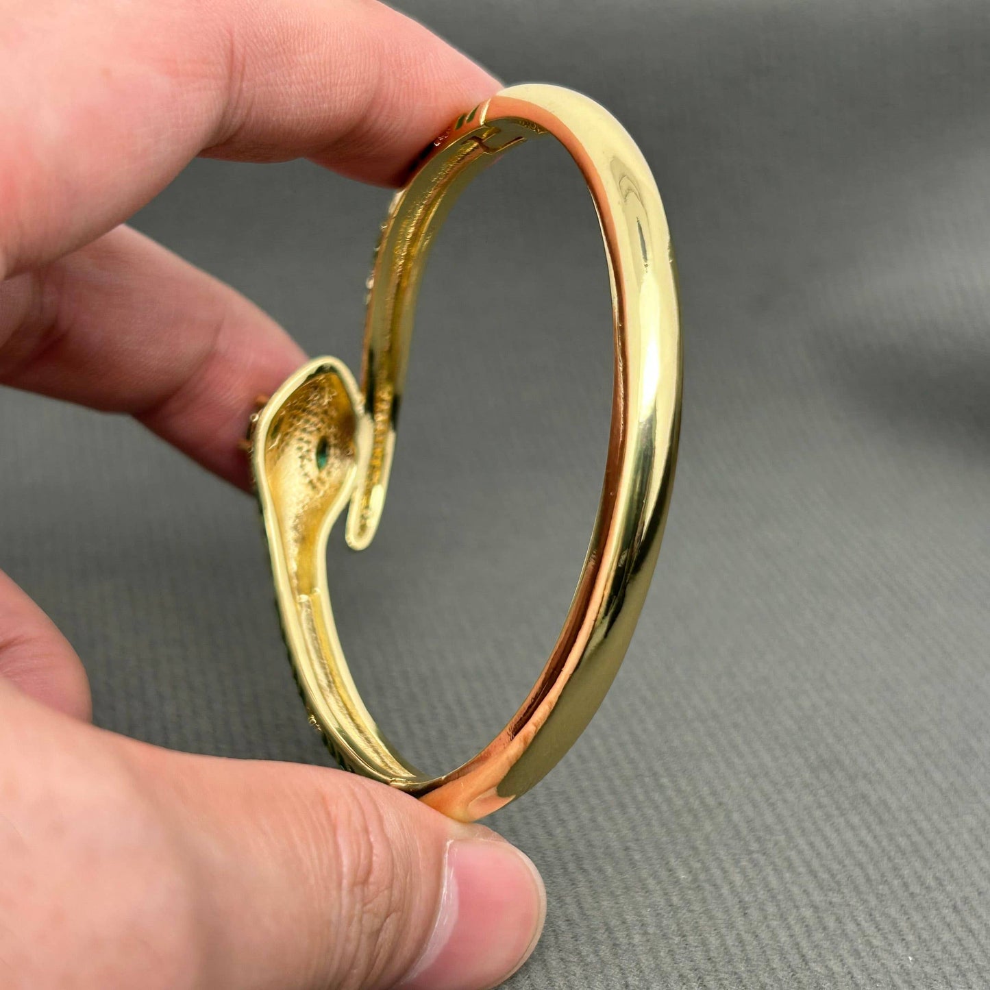 Gold plated serpent bangle in emerald green enamel - statement jewellery