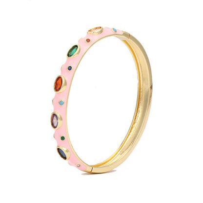 Light pink enamel bangle with cubic zirconia stones and 18k gold plating