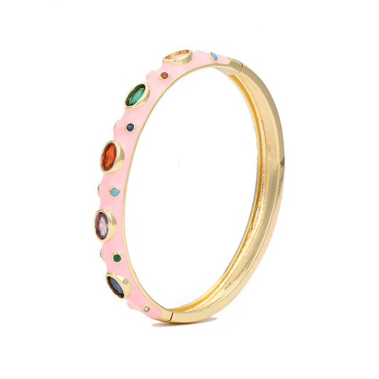 Light pink enamel bangle with cubic zirconia stones and 18k gold plating