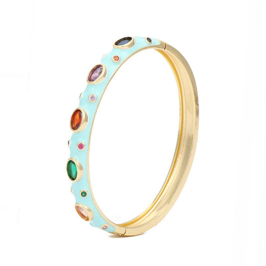 Light blue enamel bangle with cubic zirconia stones and 18k gold plating