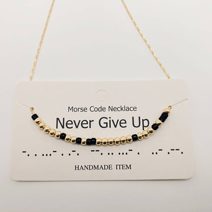 Handmade morse code beaded necklace showing hidden message detail