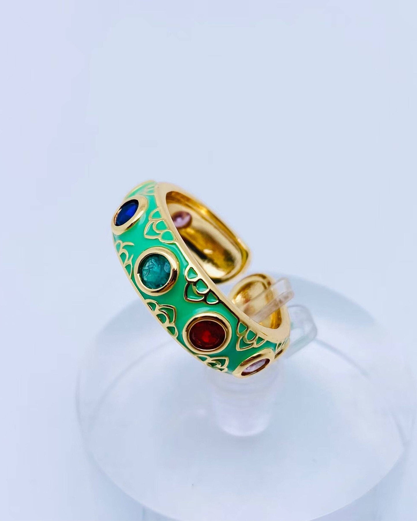 Green enamel adjustable ring with seven colors of cubic zirconia stones