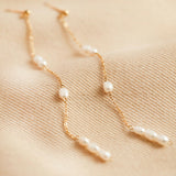 Long delicate pearl earrings