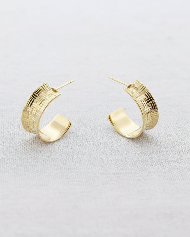 Gold woven texture hoop earrings with intricate basketweave pattern