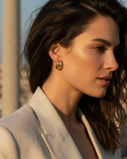 Woman wearing gold textured hoop earrings showing 2cm size and woven design
