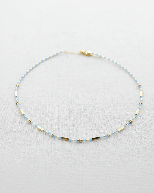 Beaded necklace on a light gray background