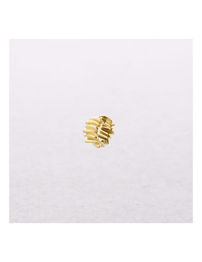 Gold ring with multiple bands on a white background