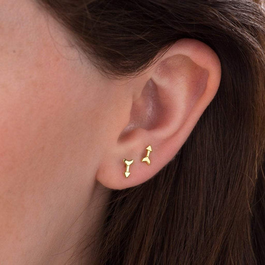 Tiny gold arrow studs