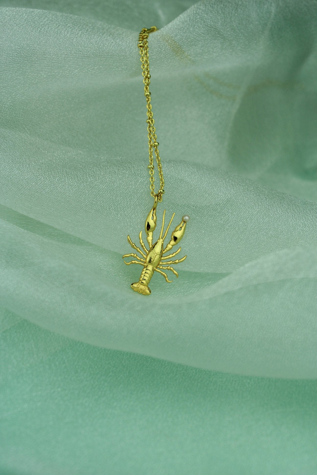 Collier avec pendentif en forme de homard