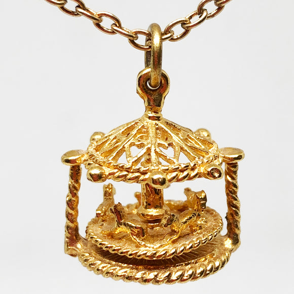 Necklace with moving merry go round charm