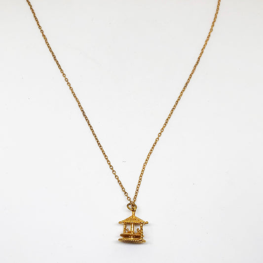 Necklace with moving merry go round charm