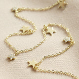 Tiny Crystal Star Charm Necklace in Gold