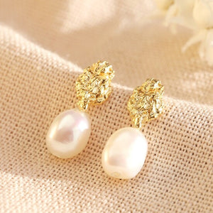 Battered gold and pearl effect earrings